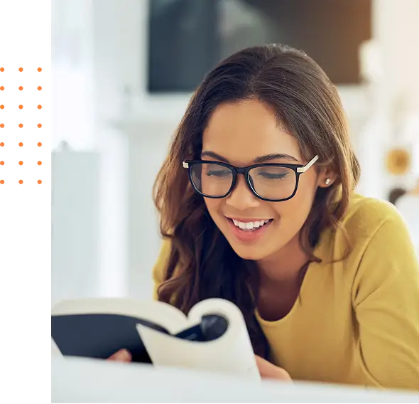 Woman reading a book happily